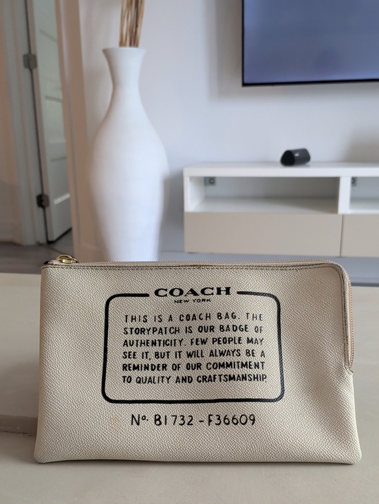 Coach Handbags - Coach Cream and Black Logo Zip Pouch